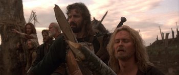 Movie still from “The 13th Warrior” (1999), directed by Michael Crichton – A group of men standing next to each other; Close Up shot, Low angle