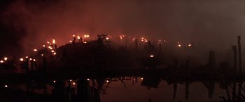 Movie still from “The 13th Warrior” (1999), directed by Michael Crichton – A fire is burning in the night sky; Extreme Wide shot, High angle
