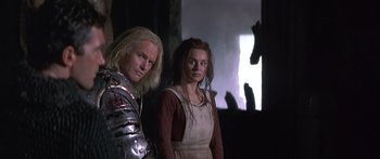 Movie still from “The 13th Warrior” (1999), directed by Michael Crichton – A man and a woman standing next to each other; Medium shot, Low angle