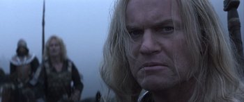 Movie still from “The 13th Warrior” (1999), directed by Michael Crichton – A person with long hair; Close Up shot, Low angle