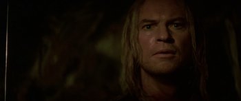 Movie still from “The 13th Warrior” (1999), directed by Michael Crichton – A person with long blonde hair; Close Up shot, Over the shoulder angle