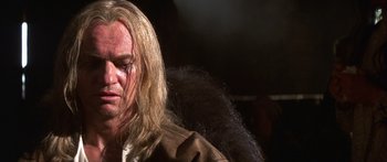 Movie still from “The 13th Warrior” (1999), directed by Michael Crichton – A person with long blonde hair; Close Up shot, Low angle