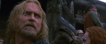 Movie still from “The 13th Warrior” (1999), directed by Michael Crichton – A person with long hair and a goatee; Close Up shot, Low angle