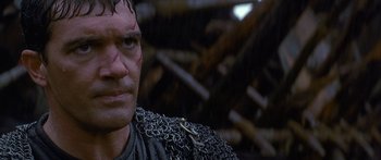 Movie still from “The 13th Warrior” (1999), directed by Michael Crichton – A person wearing a chain mail armor; Close Up shot, Low angle