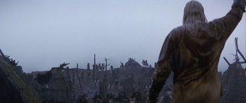 Movie still from “The 13th Warrior” (1999), directed by Michael Crichton – A group of people standing on top of a hill; Wide shot, High angle