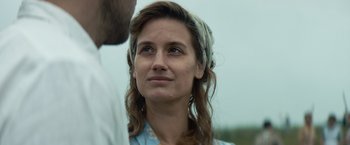 Movie still from “Out Stealing Horses” (2019), directed by Hans Petter Moland – A person wearing a head scarf; Close Up shot, Low angle