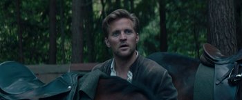 Movie still from “Out Stealing Horses” (2019), directed by Hans Petter Moland – A person wearing a jacket; Close Up shot, Over the shoulder angle