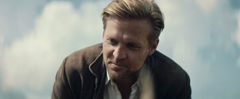 Movie still from “Out Stealing Horses” (2019), directed by Hans Petter Moland – A person wearing a jacket; Close Up shot, Over the shoulder angle