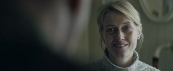 Movie still from “Out Stealing Horses” (2019), directed by Hans Petter Moland – A woman's face in front of a mirror; Close Up shot, Over the shoulder angle