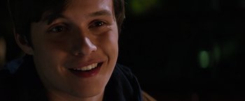 Movie still from “The 5th Wave” (2016), directed by J Blakeson – A person's face with dark background; Close Up shot, Over the shoulder angle