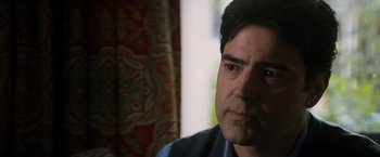 Movie still from “The 5th Wave” (2016), directed by J Blakeson – A man's face in front of a window; Close Up shot, Over the shoulder angle