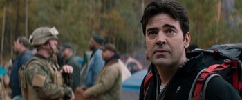 Movie still from “The 5th Wave” (2016), directed by J Blakeson – A person standing in front of a group of people; Close Up shot, Over the shoulder angle