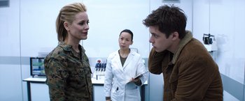 Movie still from “The 5th Wave” (2016), directed by J Blakeson – Two women and a man in a room; Medium shot, Over the shoulder angle