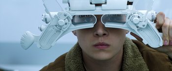 Movie still from “The 5th Wave” (2016), directed by J Blakeson – A person wearing a pair of glasses looking through a pair of glasses; Close Up shot, Low angle