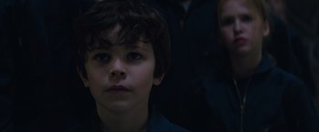 Movie still from “The 5th Wave” (2016), directed by J Blakeson – A young boy is looking into the distance; Close Up shot, Low angle