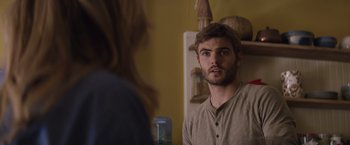Movie still from “The 5th Wave” (2016), directed by J Blakeson – A man looking at a woman in the mirror; Close Up shot, Over the shoulder angle
