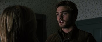 Movie still from “The 5th Wave” (2016), directed by J Blakeson – A person wearing a brown jacket; Close Up shot, Over the shoulder angle