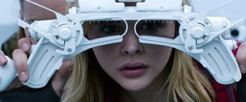 Movie still from “The 5th Wave” (2016), directed by J Blakeson – A woman with a pair of eye glasses on her head; Close Up shot, Low angle