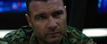 Movie still from “The 5th Wave” (2016), directed by J Blakeson – A person wearing a military uniform; Close Up shot, Over the shoulder angle