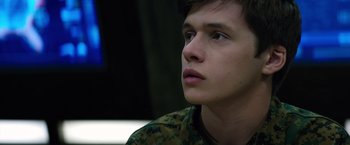 Movie still from “The 5th Wave” (2016), directed by J Blakeson – A young man in a military uniform looking to his left; Close Up shot, Low angle