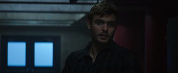 Movie still from “The 5th Wave” (2016), directed by J Blakeson – A person wearing a plaid shirt; Close Up shot, Over the shoulder angle