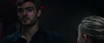 Movie still from “The 5th Wave” (2016), directed by J Blakeson – A person wearing a plaid shirt; Close Up shot, Over the shoulder angle