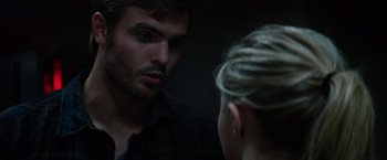 Movie still from “The 5th Wave” (2016), directed by J Blakeson – A man and a woman looking at each other in a mirror; Close Up shot, Over the shoulder angle