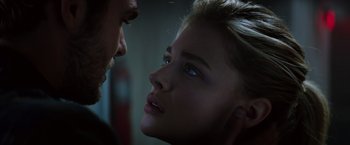 Movie still from “The 5th Wave” (2016), directed by J Blakeson – A young man and a young woman face to face; Close Up shot, Over the shoulder angle