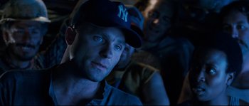 Movie still from “The Abyss” (1989), directed by James Cameron – A person wearing a hat; Close Up shot, Over the shoulder angle