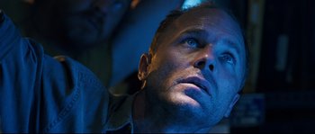 Movie still from “The Abyss” (1989), directed by James Cameron – A person looking up at the sky; Close Up shot, Low angle