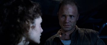 Movie still from “The Abyss” (1989), directed by James Cameron – A man and a woman looking at each other; Close Up shot, Over the shoulder angle