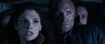 Movie still from “The Abyss” (1989), directed by James Cameron – A man and a woman are looking at the camera; Close Up shot, Low angle