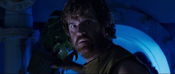Movie still from “The Abyss” (1989), directed by James Cameron – A person holding a plant; Close Up shot, Low angle