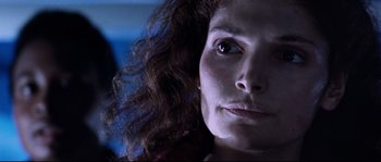 Movie still from “The Abyss” (1989), directed by James Cameron – A woman's face in a dark room; Close Up shot, Low angle