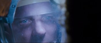 Movie still from “The Abyss” (1989), directed by James Cameron – A man's face with a helmet on; Extreme Close Up shot, Overhead angle