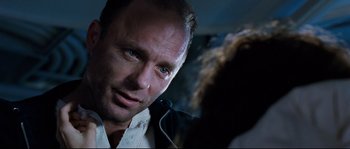 Movie still from “The Abyss” (1989), directed by James Cameron – A person looking at the camera; Close Up shot, Over the shoulder angle