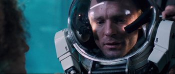 Movie still from “The Abyss” (1989), directed by James Cameron – A person in a space suit; Close Up shot, Overhead angle