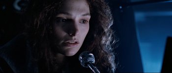 Movie still from “The Abyss” (1989), directed by James Cameron – A person holding a microphone; Close Up shot, Low angle