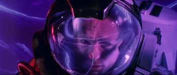 Movie still from “The Abyss” (1989), directed by James Cameron – A man in a space helmet looking at the camera; Close Up shot, Overhead angle