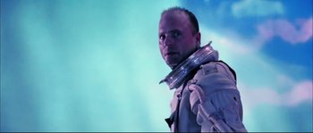 Movie still from “The Abyss” (1989), directed by James Cameron – A man in a space suit is looking into the distance; Close Up shot, Low angle