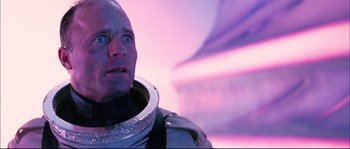 Movie still from “The Abyss” (1989), directed by James Cameron – A man in a spacesuit looking up into the sky; Close Up shot, Low angle