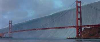 Movie still from “The Abyss” (1989), directed by James Cameron – A large wave is coming from a bridge in the ocean; Extreme Wide shot, Low angle
