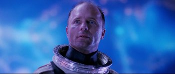 Movie still from “The Abyss” (1989), directed by James Cameron – A man in a space suit looking upward; Close Up shot, Low angle