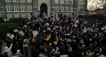 Movie still from “The Adjustment Bureau” (2011), directed by George Nolfi – A crowd of people gathered in front of a building; Extreme Wide shot, High angle