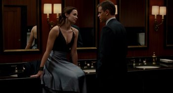 Movie still from “The Adjustment Bureau” (2011), directed by George Nolfi – A man and a woman standing next to each other in a room; Medium shot, Over the shoulder angle