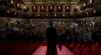 Movie still from “The Adjustment Bureau” (2011), directed by George Nolfi – A man in a suit is on a red carpet; Extreme Wide shot, High angle