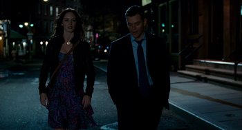 Movie still from “The Adjustment Bureau” (2011), directed by George Nolfi – A man and a woman walking down a street at night; Medium shot, Over the shoulder angle