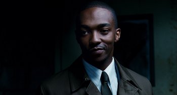 Movie still from “The Adjustment Bureau” (2011), directed by George Nolfi – A man wearing a suit and tie in the dark; Close Up shot, Low angle