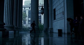 Movie still from “The Adjustment Bureau” (2011), directed by George Nolfi – A man running in the middle of a building; Extreme Wide shot, High angle