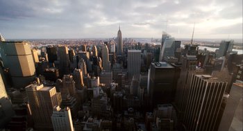 Movie still from “The Adjustment Bureau” (2011), directed by George Nolfi – A view of a large city from the top of a skyscraper; Extreme Wide shot, High angle